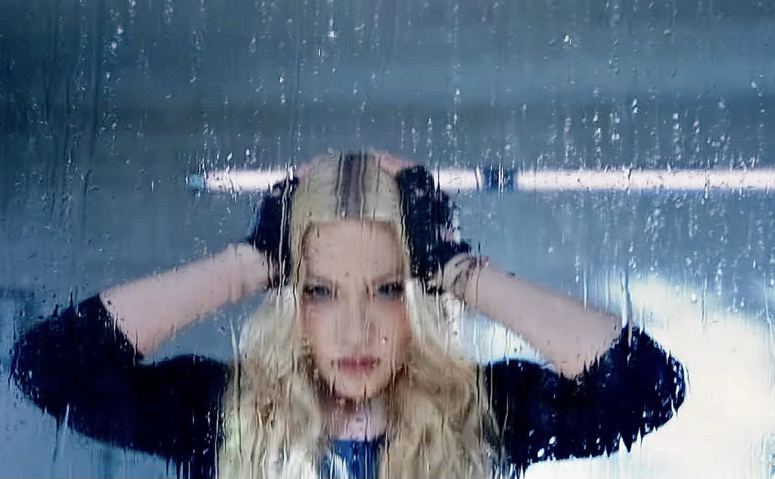 Video still of Madonna with Lee Broom light behind