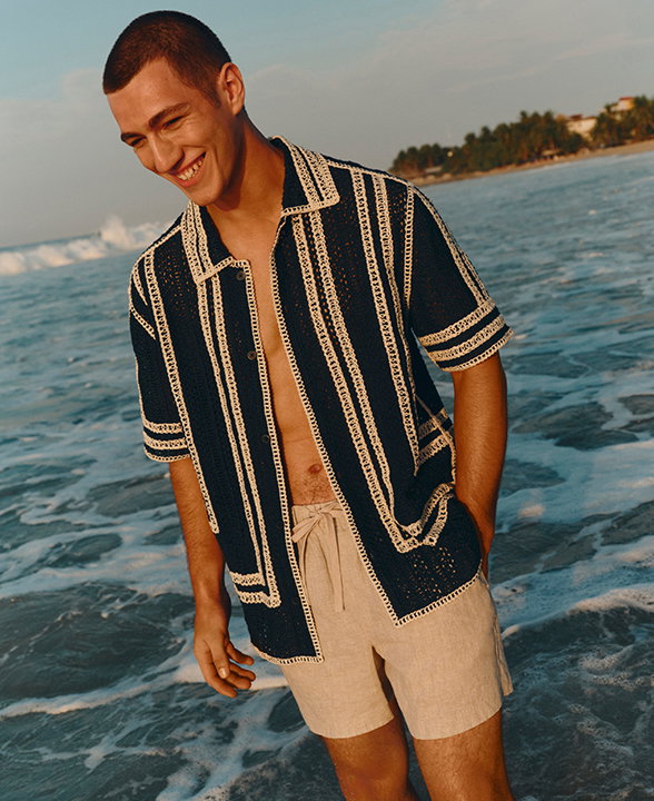 Man wearing an Ecru Mix Relaxed Fit Knitted Short Sleeve Shirt