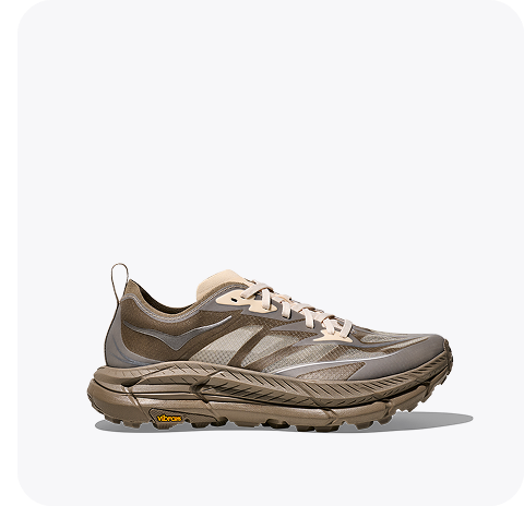 A side view of the Tor Summit lifestyle shoe in a beige and green colour scheme.