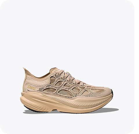 A side view of the Mach X Caged lifestyle shoe in a solid beige colour.