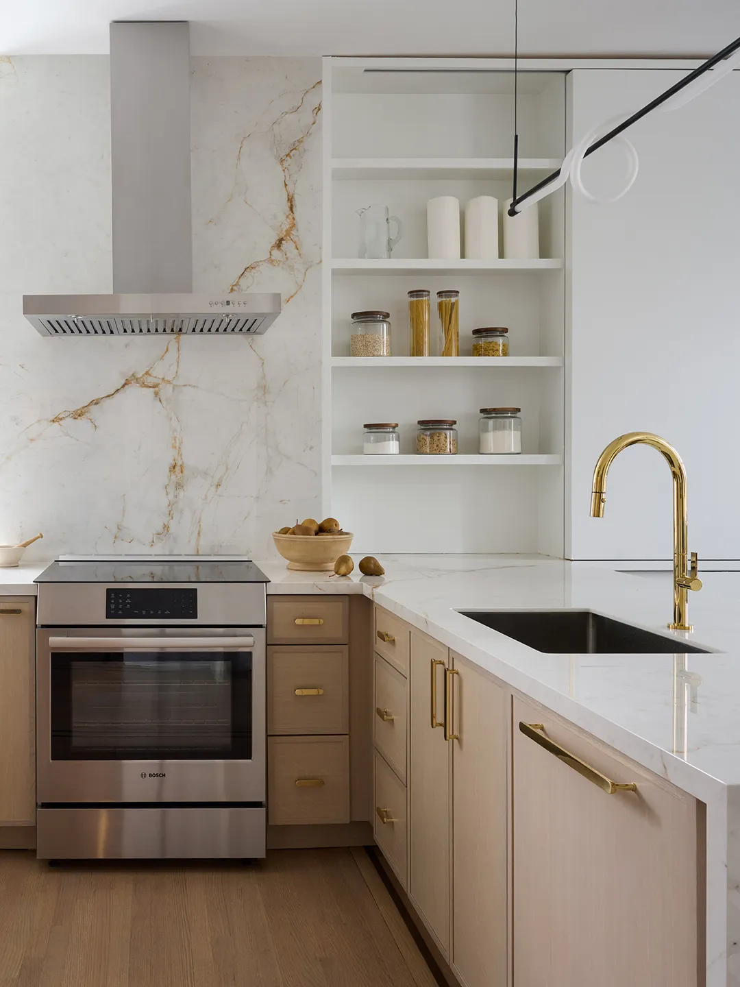 A Wall of Built-Ins Is the Key to This Kitchen–Living Room Combo’s Flow