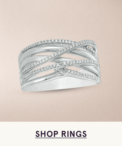 Wide silver multi-band ring comprised of criss-cross pavé diamonds. Click here to shop rings