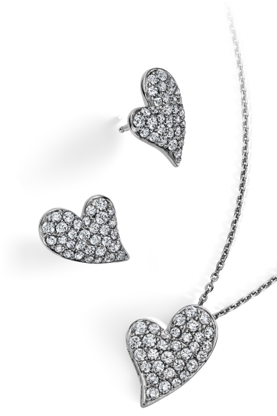 A heart necklace and matching earrings. Iconic bridal details in elegant silhouettes.