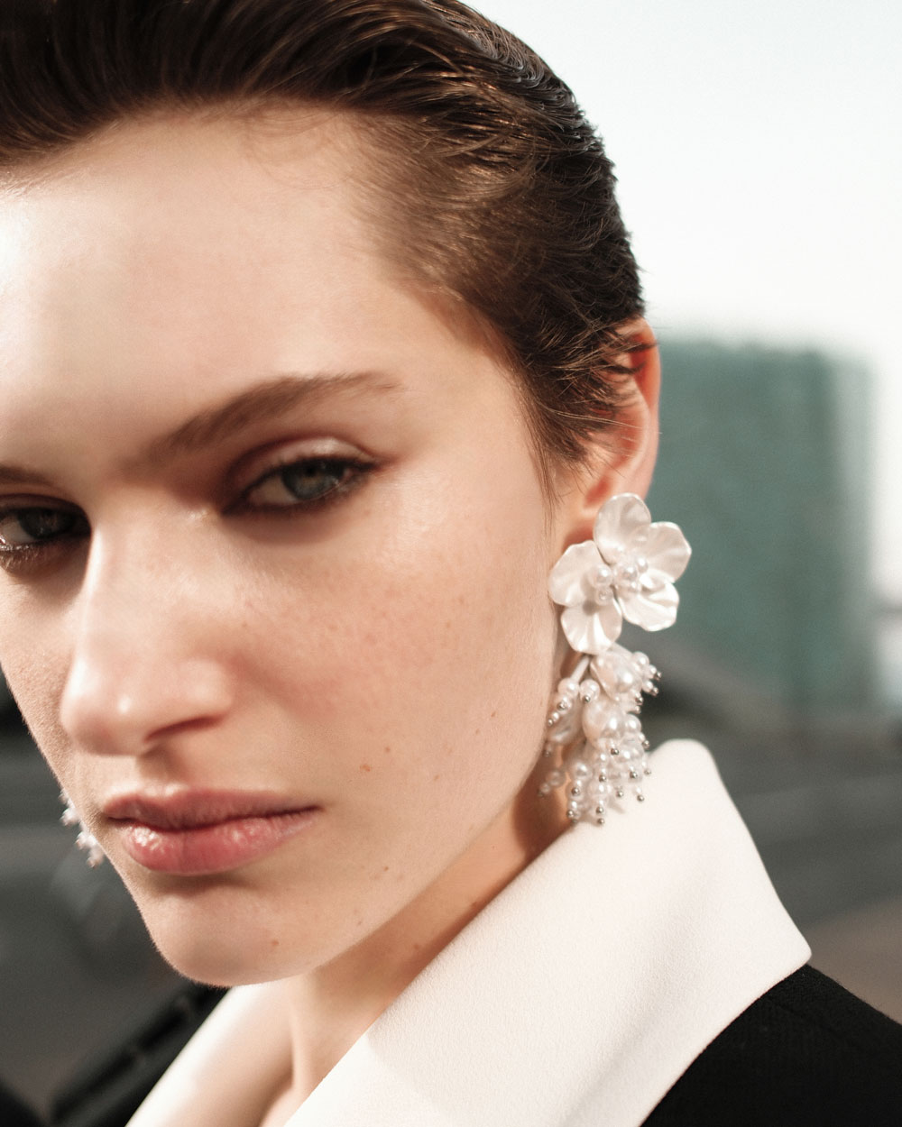 A picture of a woman wearing Pearl Flower Beaded Cluster Earring