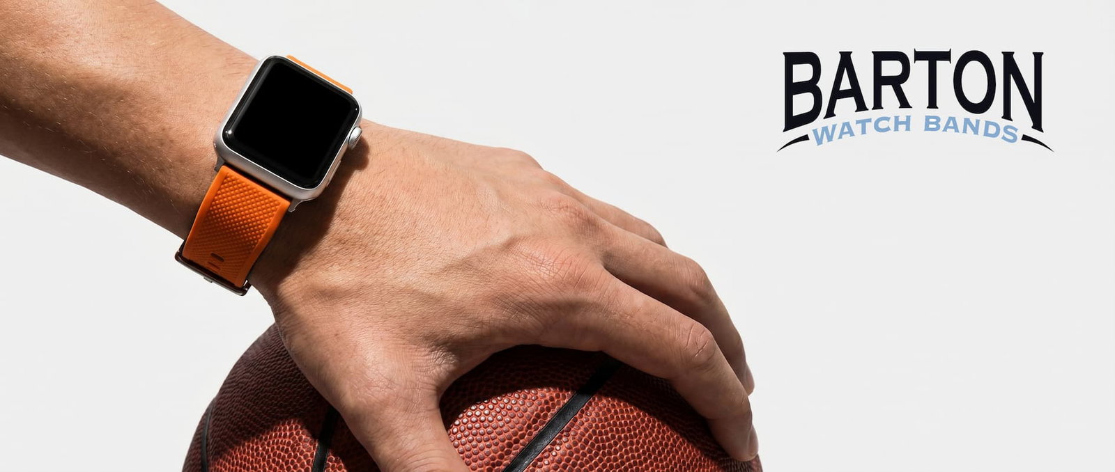 orange elite silicone band on basketball