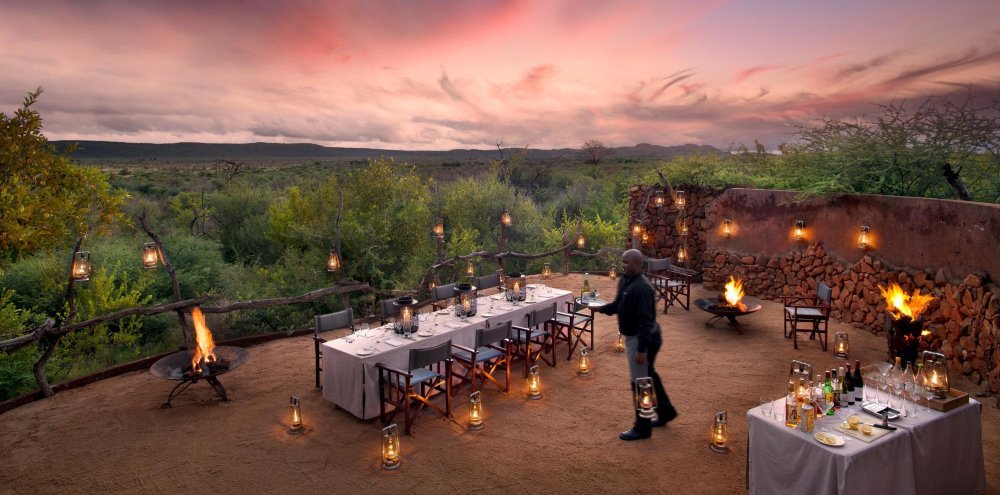 Lantern-lit dinner setting at Madikwe Safari Lodge