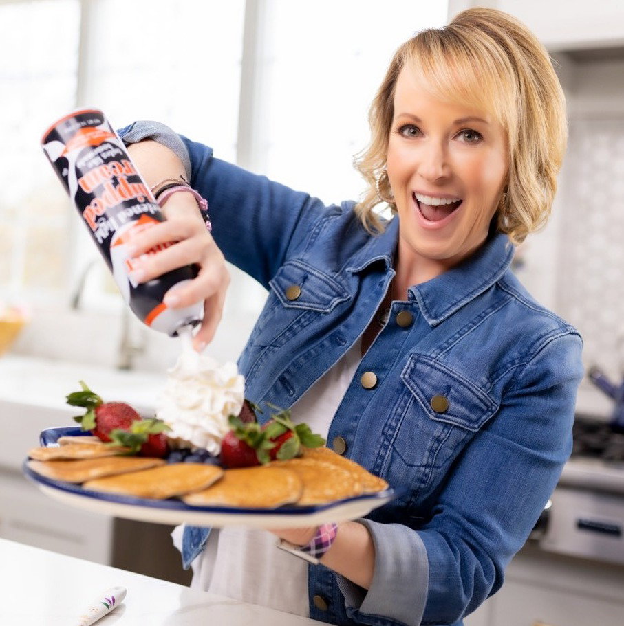 Tara Tesher, in the kitchen with a platter of pancakes