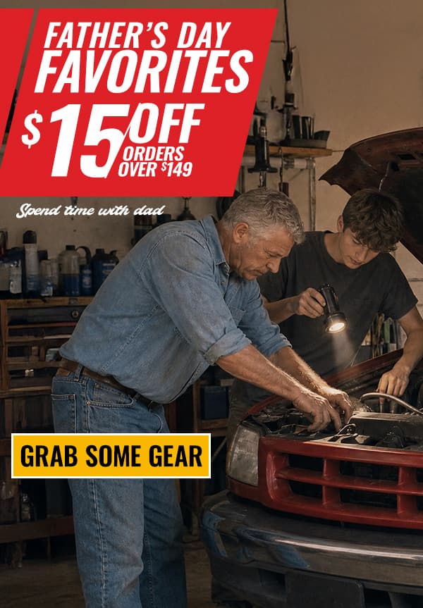 Father and son working on a truck in a garage with a Father's Day offer: $15 off orders over $149.