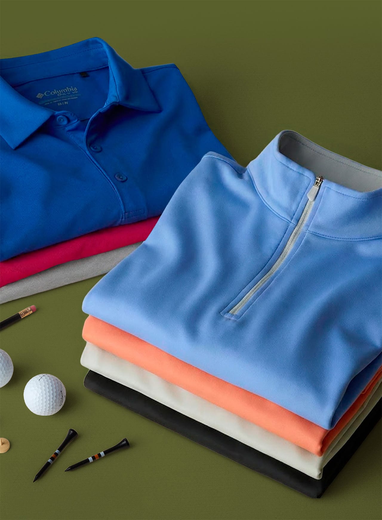 Colorful polos stacked on a green background.