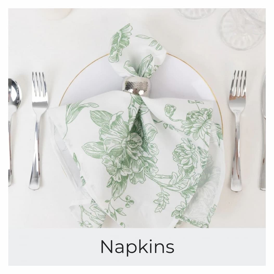 A lavender napkin is folded and held by a gold napkin ring on a white plate.