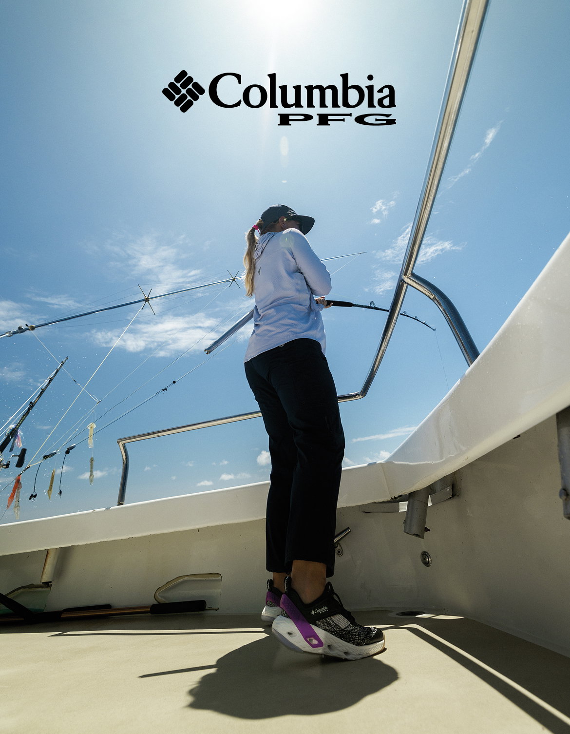A woman fishing off a boat.