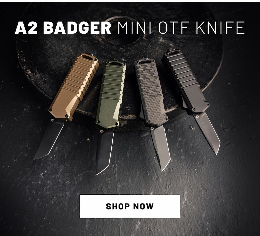 A2 Badger Mini Automatic OTF Knife placed in dark tactical background.