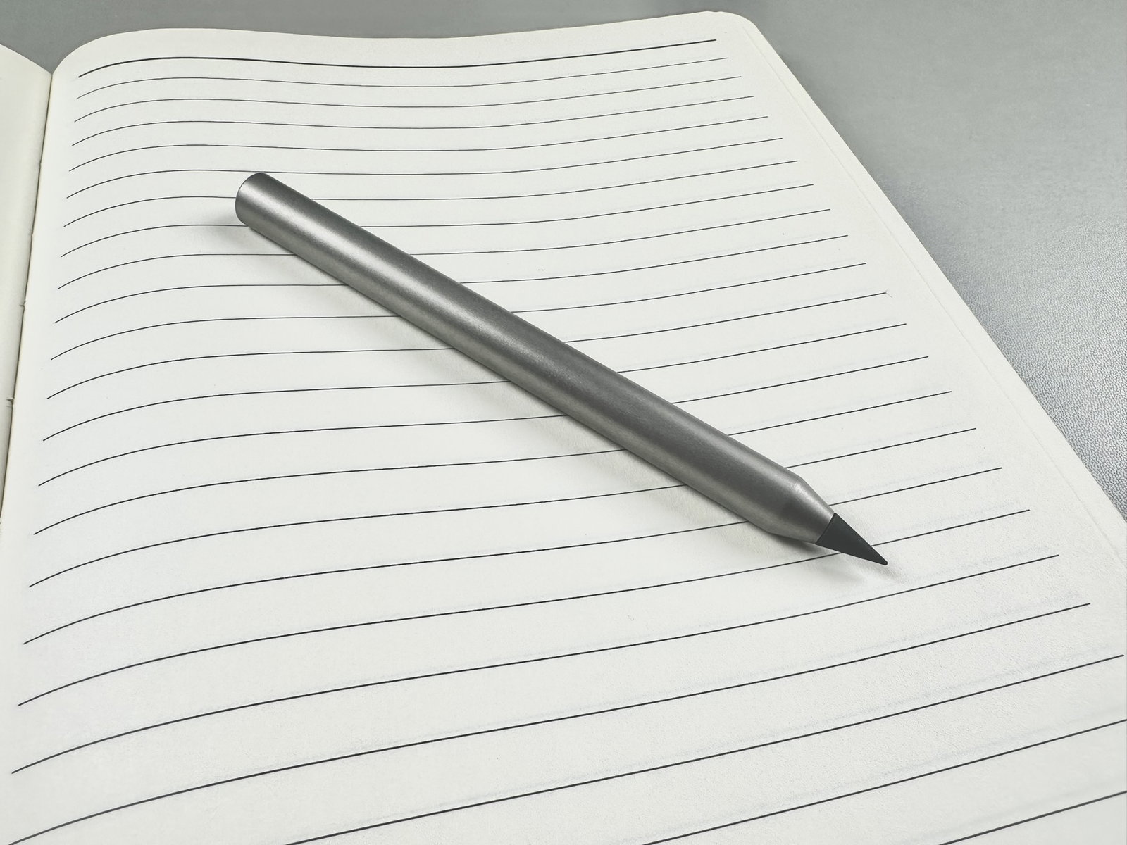 Infinity Pencil on notebook