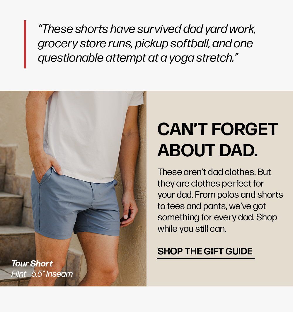 A man wears blue shorts and a white shirt by stone stairs. Text reads: '“These shorts have survived... yoga stretch.” Can't Forget About Dad... Shop The Gift Guide Tour Short Flint - 5.5" Inseam'