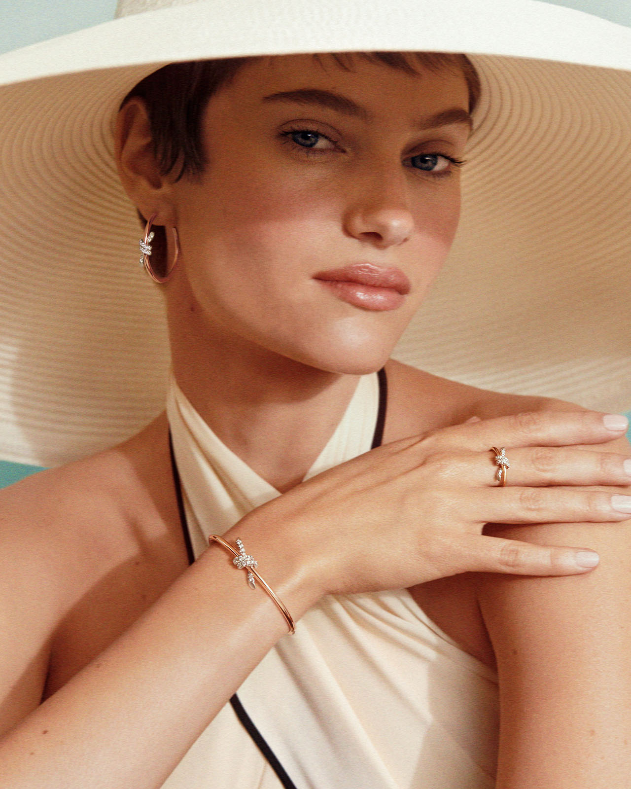 [Model wearing Knot by Tiffany jewellery with a mix of metal]