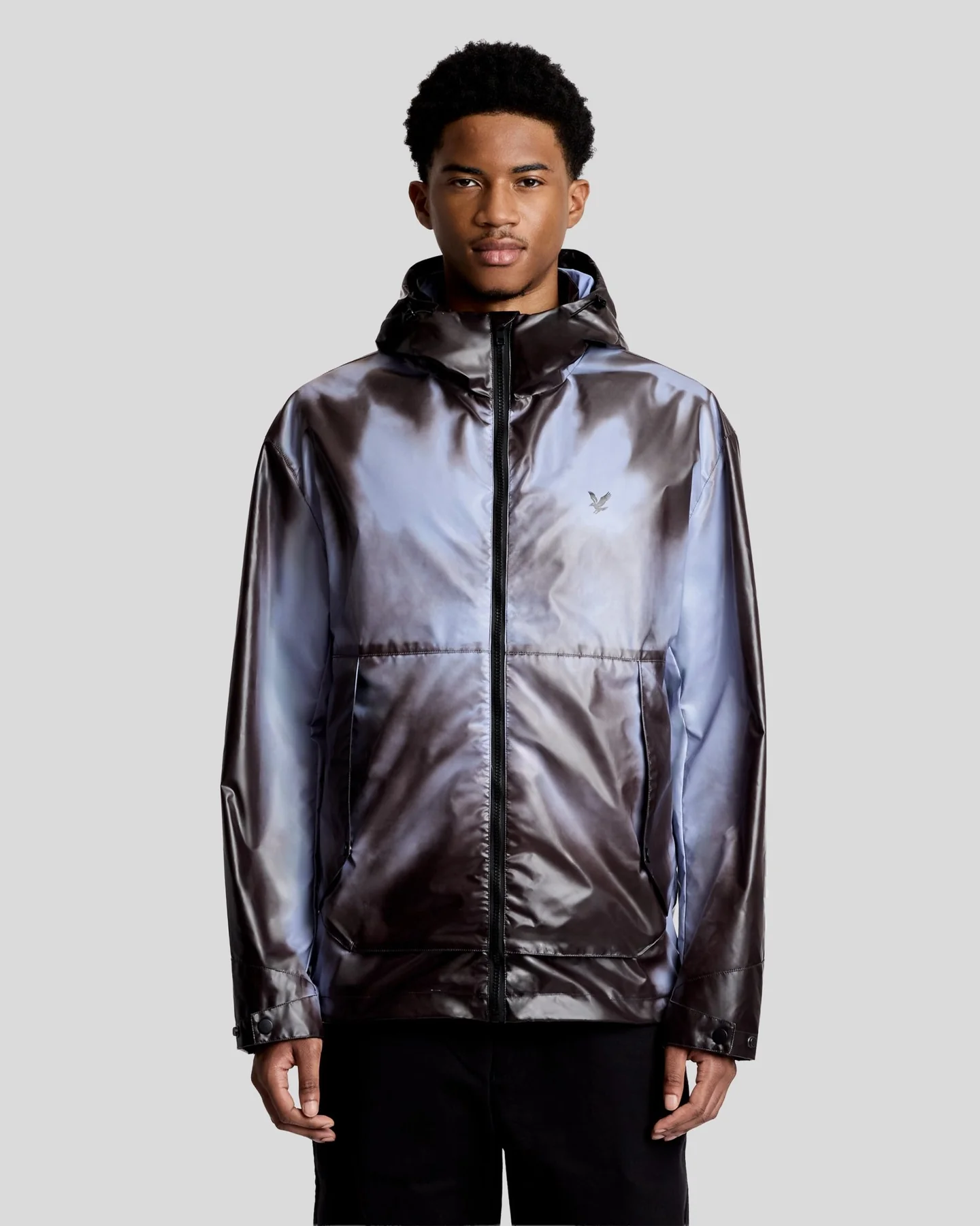 Man wears Heat Reactive Shell Jacket in Dark Navy/Bubble Blue