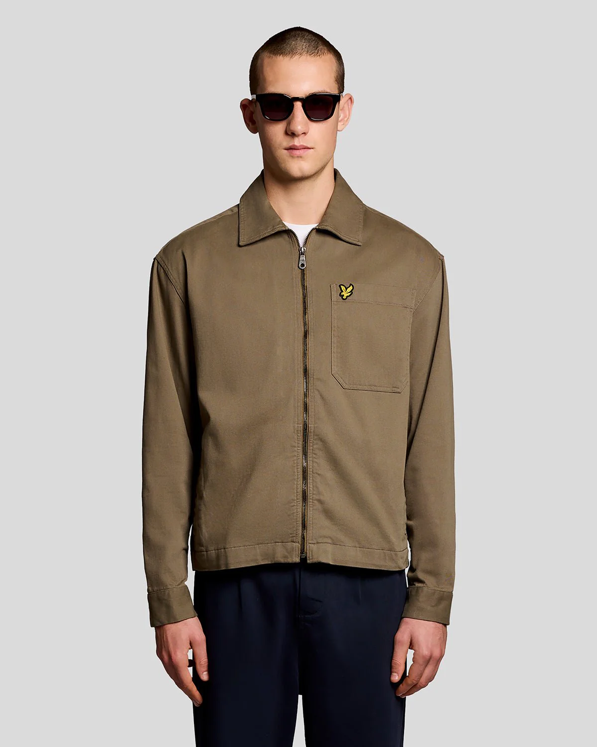 Man wears Lightweight Enzyme Wash Overshirt in Khaki Ash