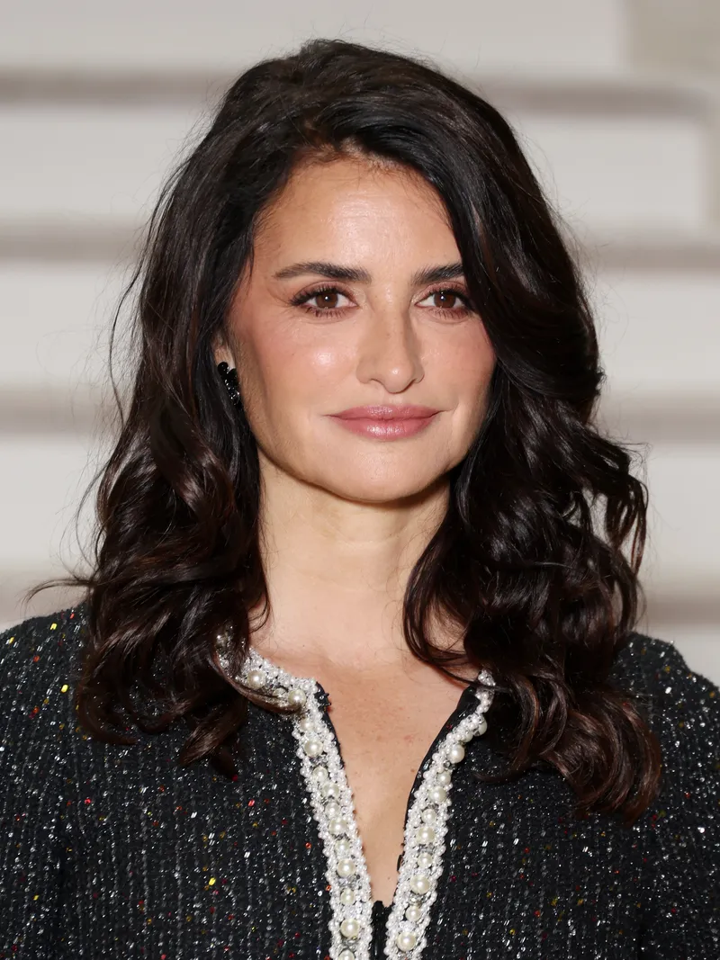 Image may contain: Penélope Cruz, Head, Person, Face, Adult, Black Hair, Hair, Body Part, Neck, Dimples, Happy, and Smile