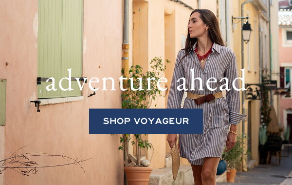 Adventure Ahead - Shop Voyageur - Image of a woman wearing a red and blue striped shirt dress.