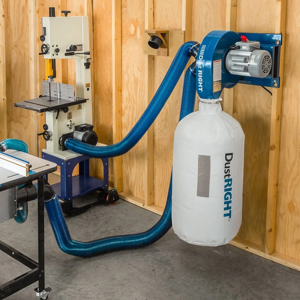 Dust collector hooked up to router table and band saw
