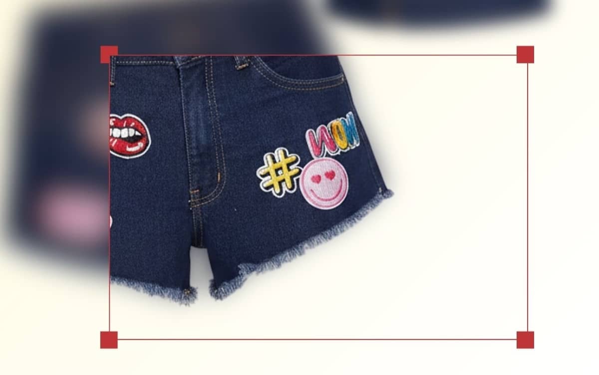 Shop Embroidered Patch Graphic Raw Hem Denim Shorts