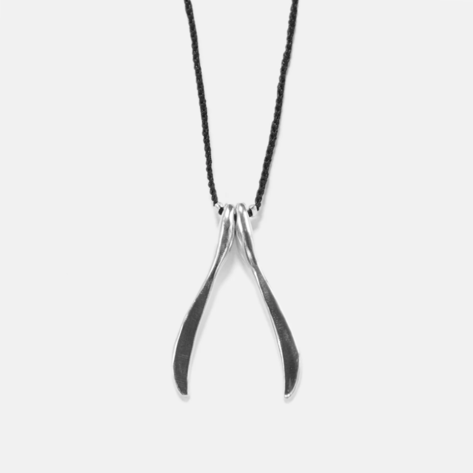 Necklace with wishbone shaped silver pendant on black cord
