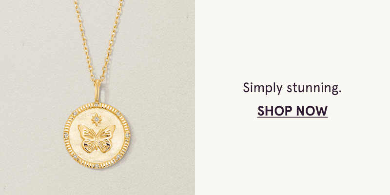 A gold necklace with a butterfly medallion pendant. Simply stunning. Click here to shop now