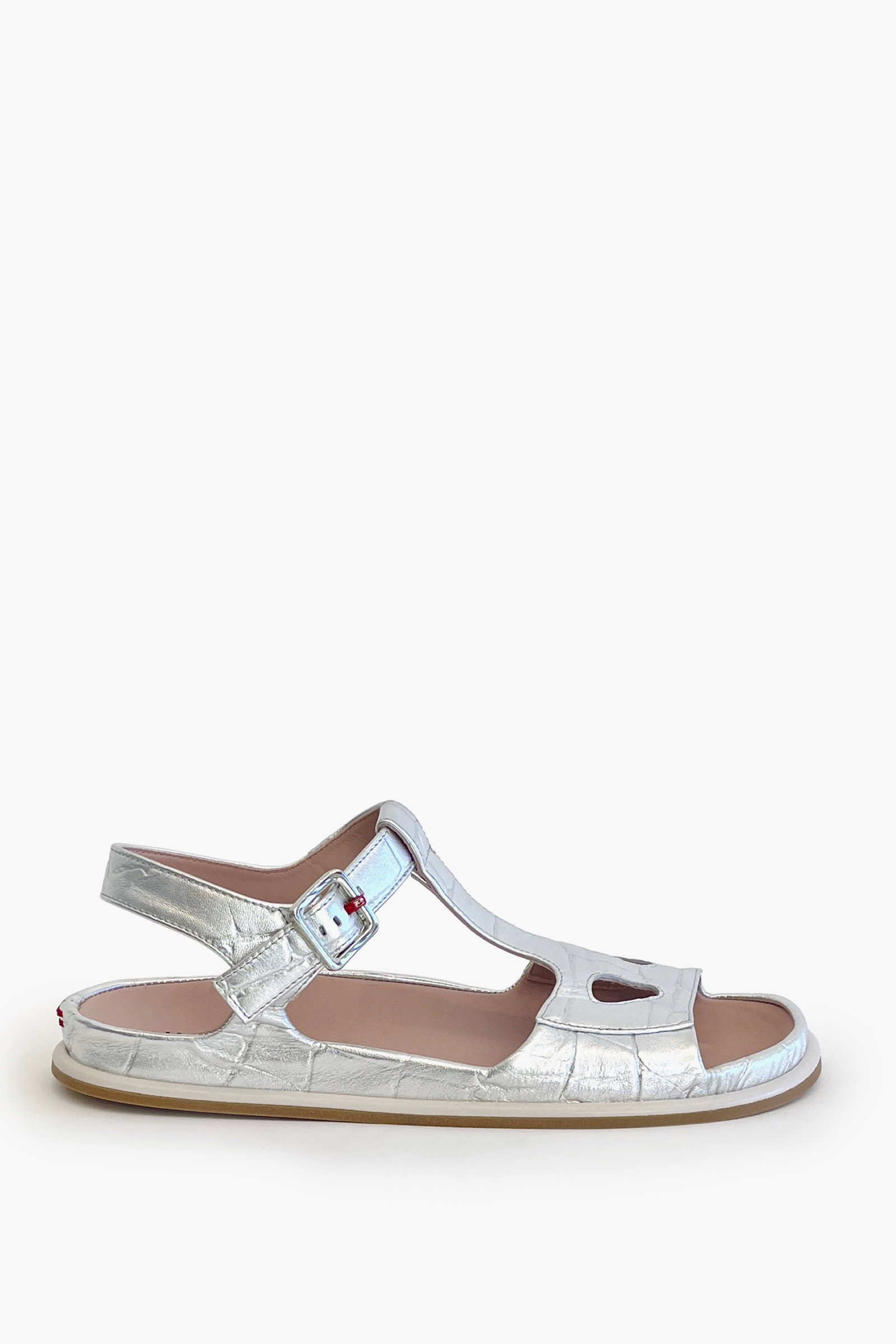 Silver croco ankle strap flat sandal on a white background