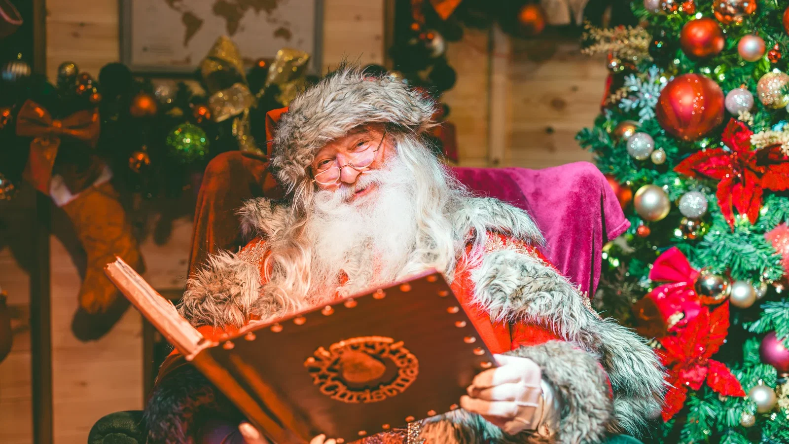 Santa reading a Christmas Book in his Bluestone lodge