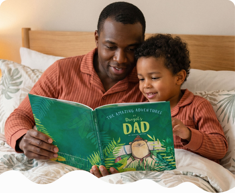 A father and young son lying in bed together, laughing while reading a personalised "The Amazing Adventures of Dad" book