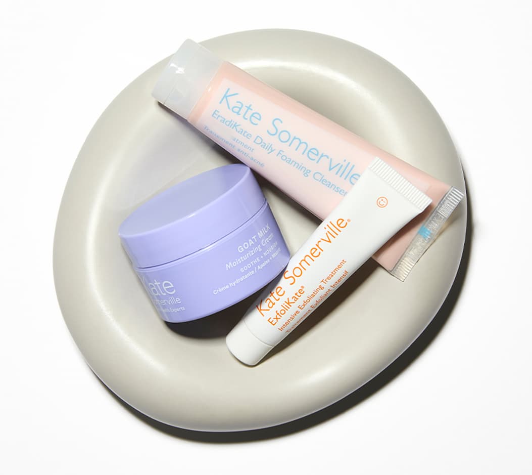 Tray of EradiKate Cleanser, ExfoliKate Intensive + Goat Milk Cream minis. 
