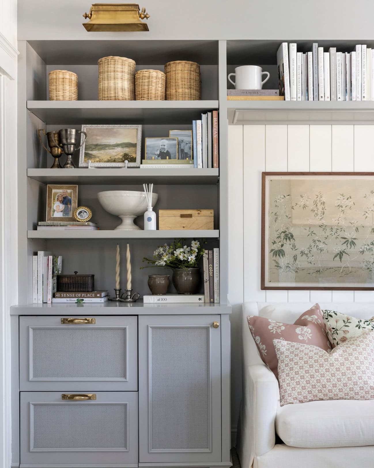 Grey built in shelf styled with accessories.