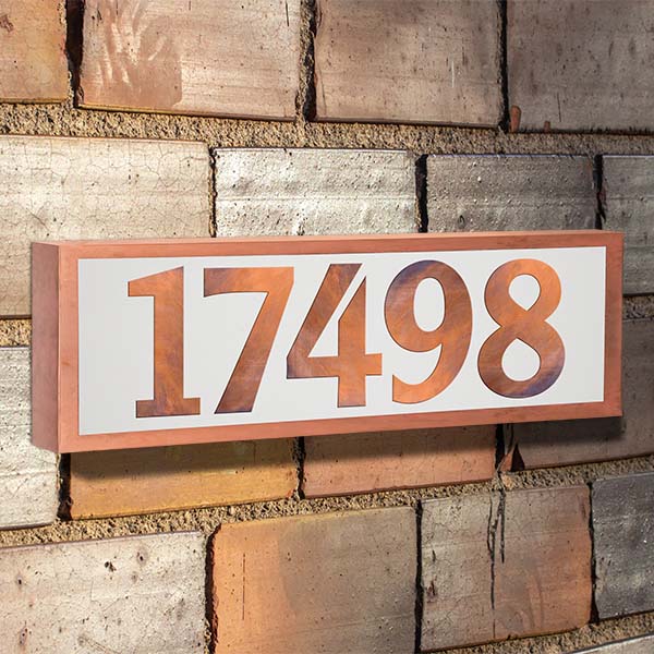 Copper finished illuminated address sign.