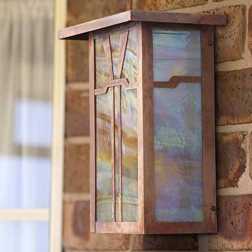 A rectilinear Arts & Crafts wall sconce.
