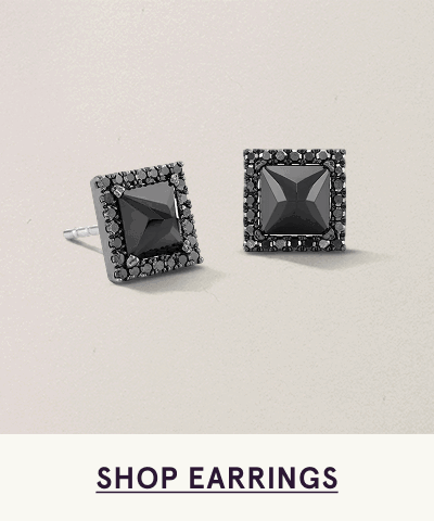 Pair of square black studs with center stone & border. Click here to shop earrings