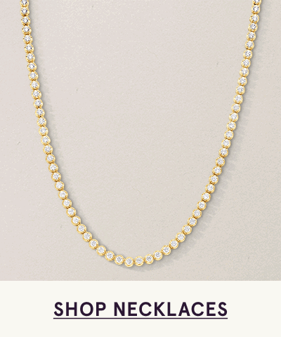 Gold tennis chain necklace with round diamonds. Click here to shop necklaces