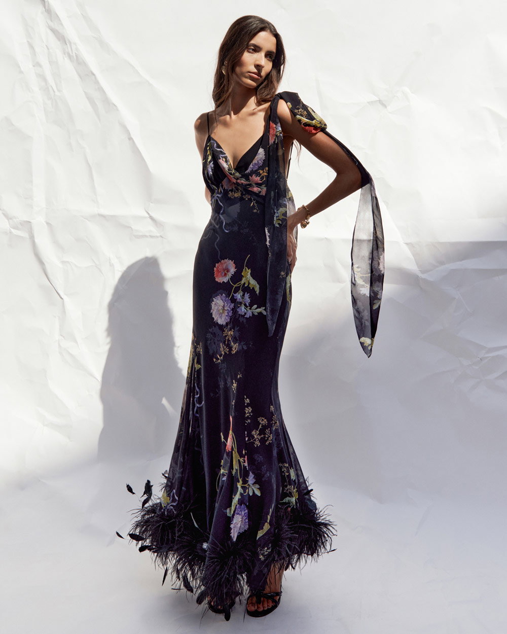 A picture of a woman wearing the Black Floral Georgette Feather Maxi Dress