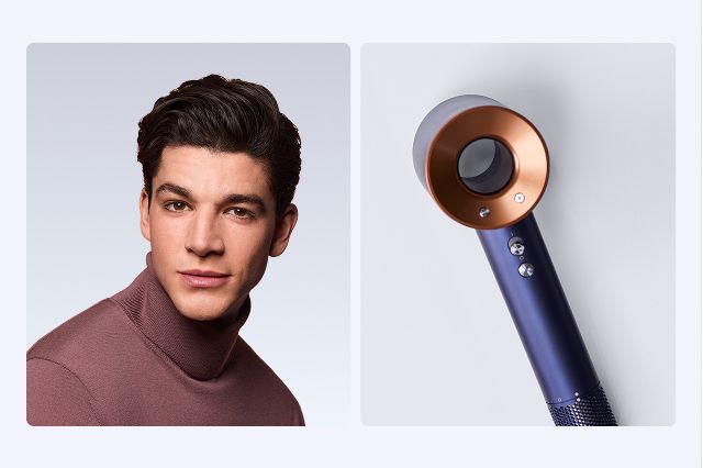 Male model with sleek styled hair next to the Dyson Supersonic hair dryer.
