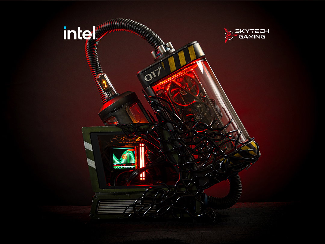 a PC in the shape of a containment tank with a monitor next to it.