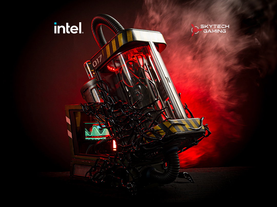 a PC in the shape of a containment tank with a monitor next to it.