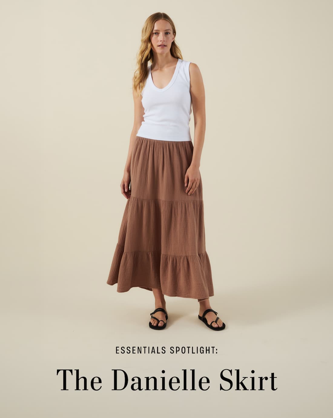 Image shows a model wearing the Danielle Skirt in Tree. Text reads: Essentials Spotlight: The Danielle Skirt