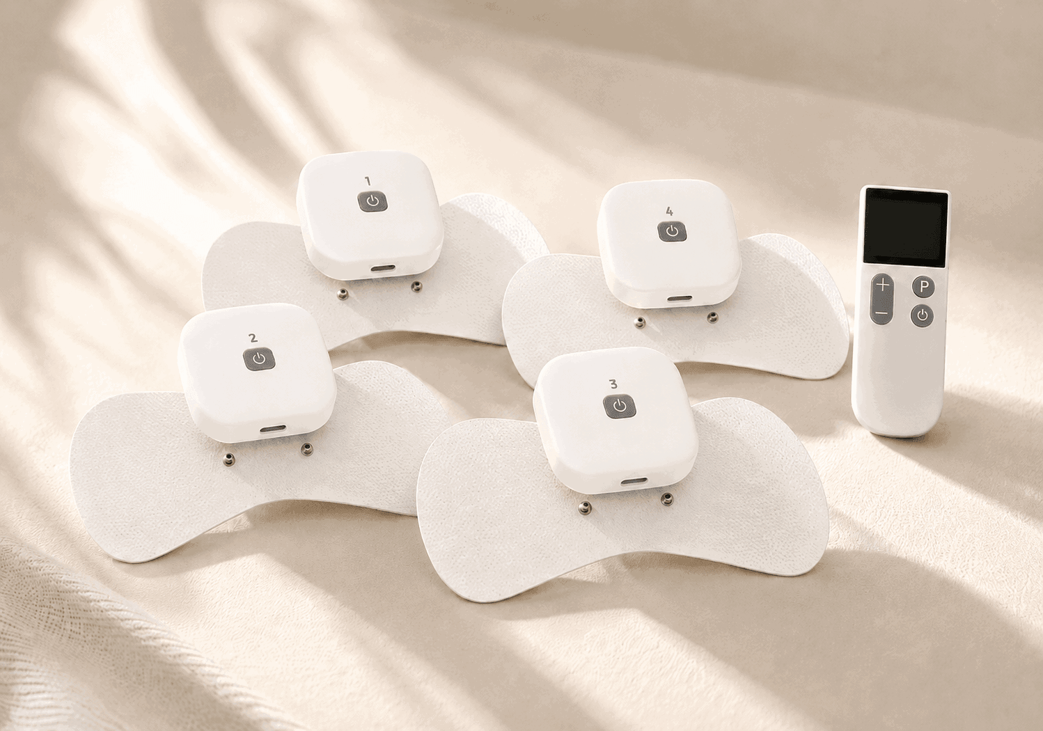 Wellue Wireless Remote Control TENS Unit with four wireless pods, electrode pads, and remote control displayed on soft fabric.