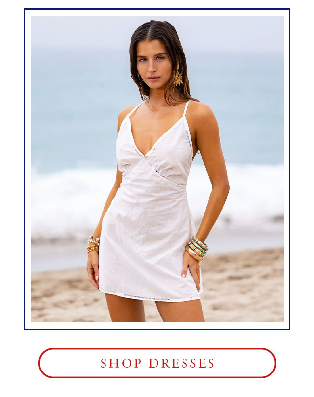 White mini dress with sequins. Shop dresses. 