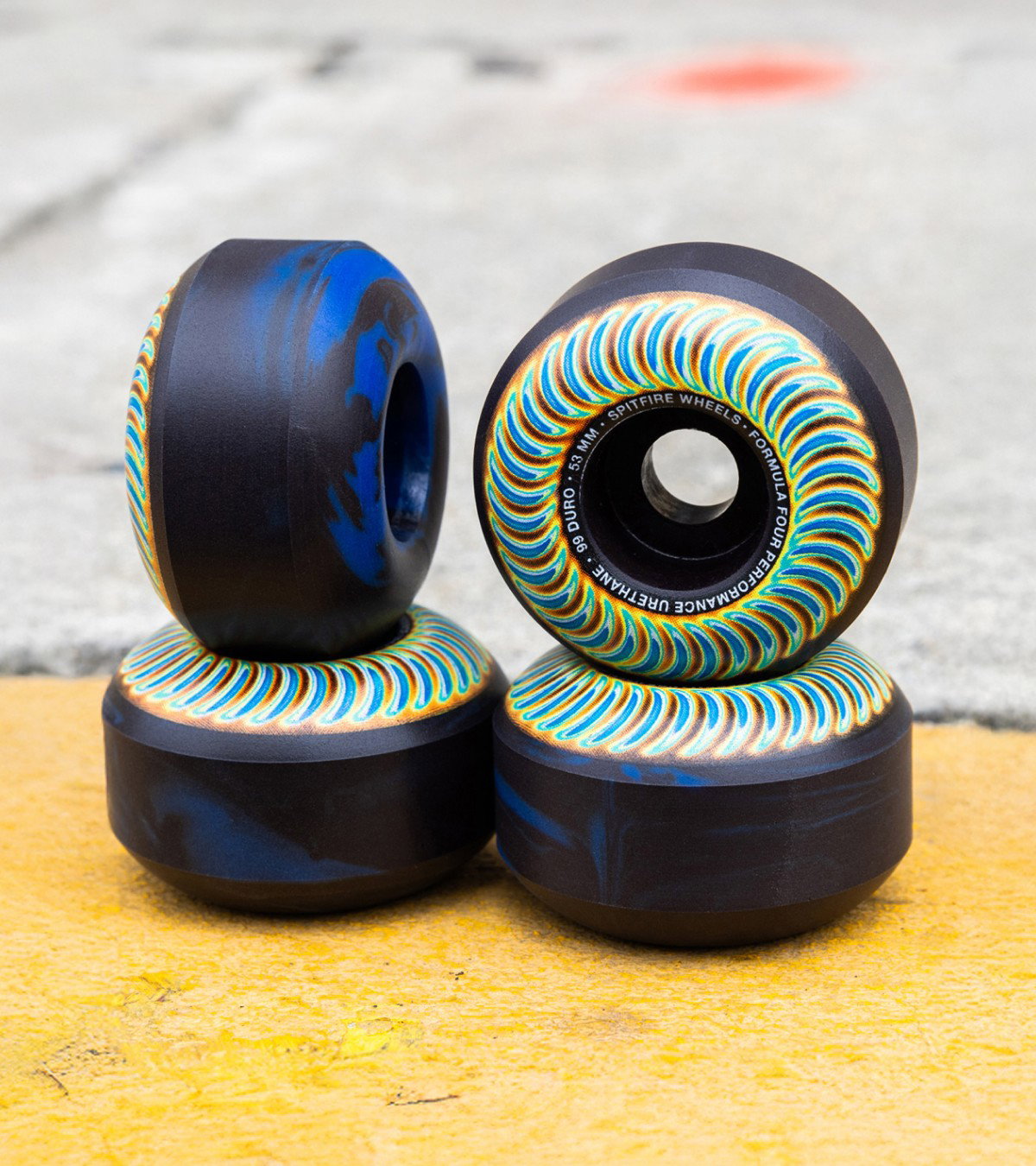 Shop sale skate wheels, like these tie-dye styles from Spitfire