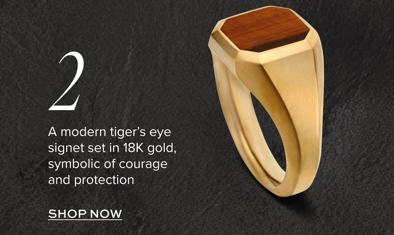 A modern tiger's eye signet set in 18K gold, symbolic of courae and protection