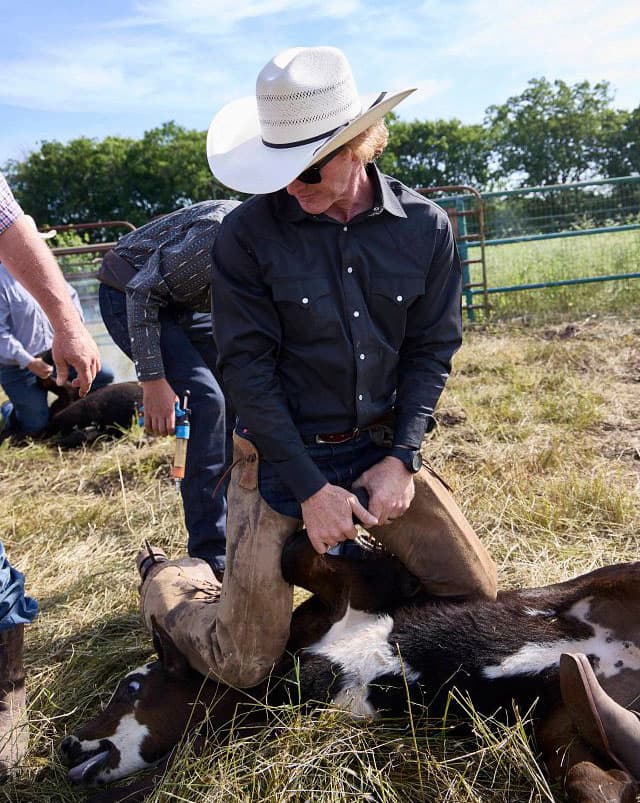 A man wearing Justin Boots.