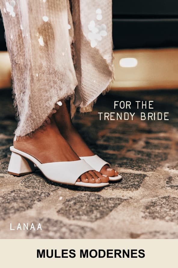 A close-up photo shows a person's foot wearing white block heel "LANAA" mules. Overlaid white text on the right reads "FOR THE TRENDY BRIDE", and the bottom text reads "MODERN MULES".