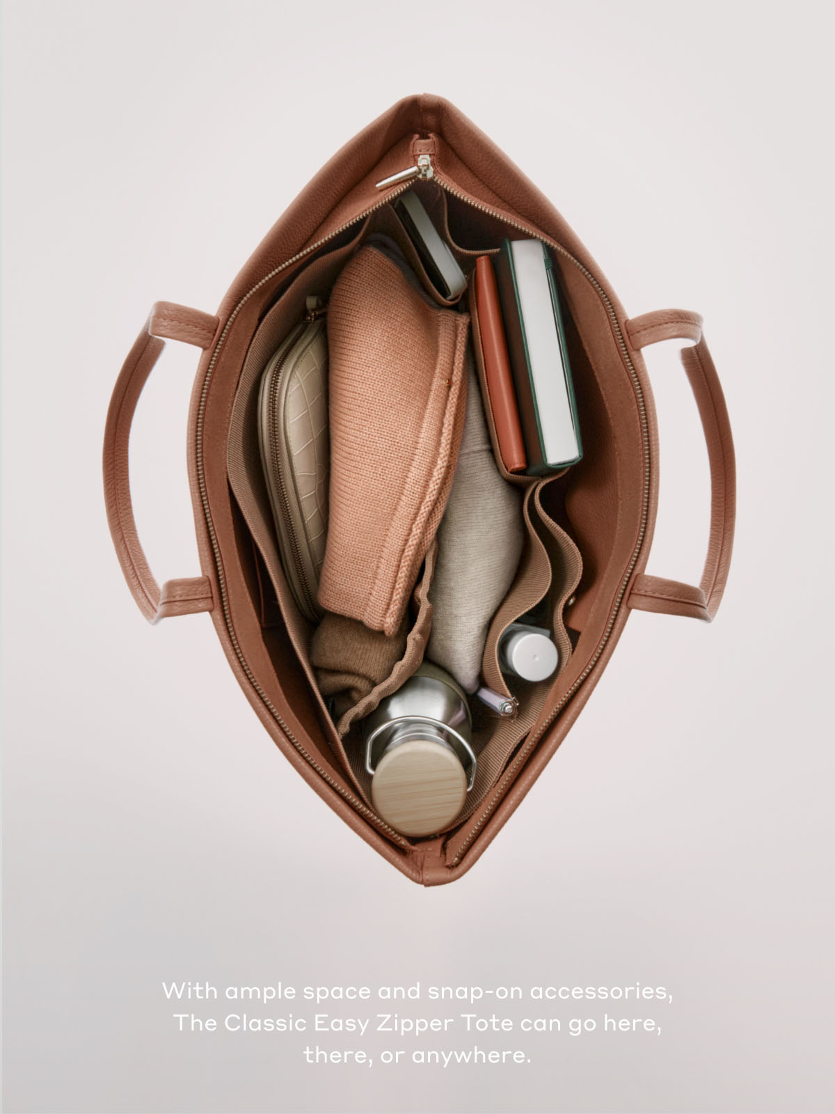 With ample space and snap-on accessories, The Classic Easy Zipper Tote can go here, there, or anywhere.