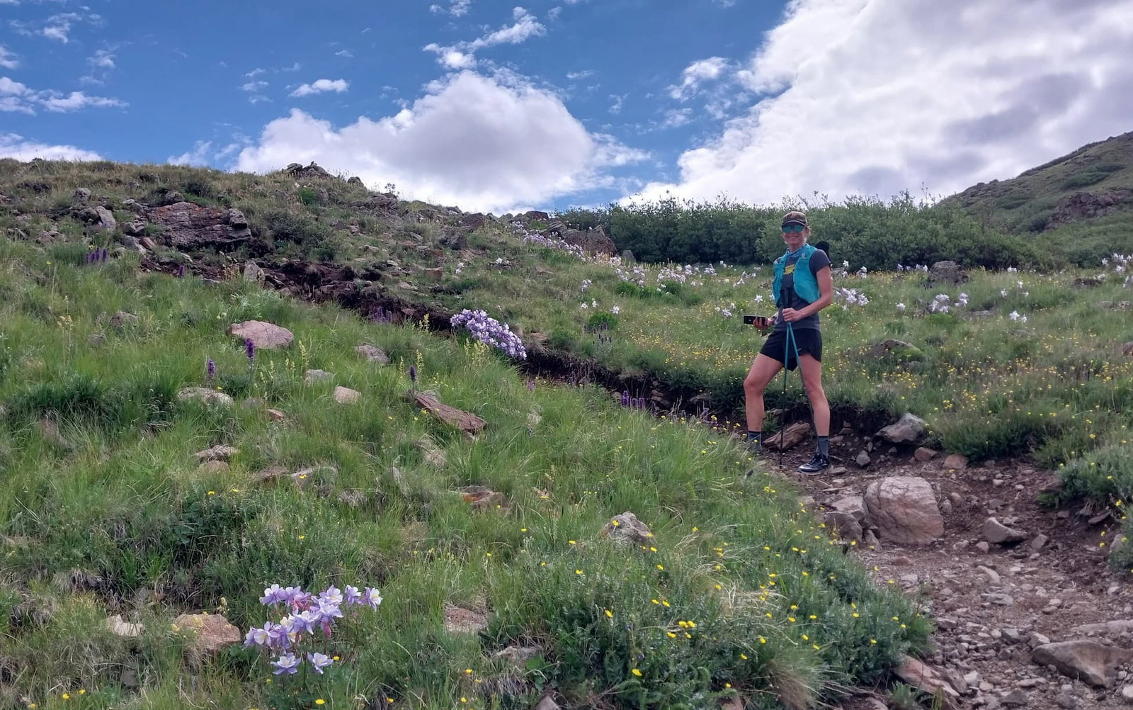 women on trail run on mountain
