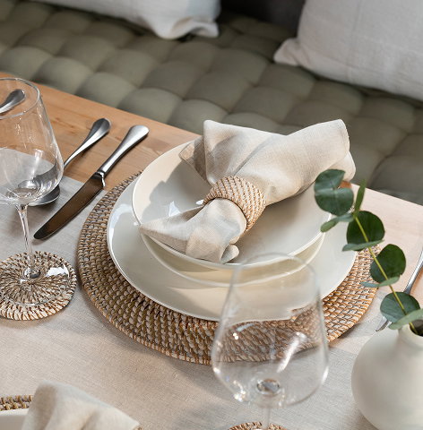 Place setting with rattan round placemats featured